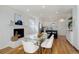 Dining room with a fireplace, wood floors, and white accent wall at 525 W Midway Blvd, Broomfield, CO 80020