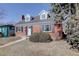 Beautiful brick home featuring a front door and manicured lawn at 525 W Midway Blvd, Broomfield, CO 80020