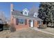 Charming brick home featuring a classic design with black shutters and a well-maintained front yard at 525 W Midway Blvd, Broomfield, CO 80020