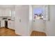 Bright kitchen featuring white cabinets, stainless appliances, and charming Dutch door leading outside at 525 W Midway Blvd, Broomfield, CO 80020