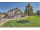 Landscaped backyard with patio, lawn, and rock garden at 4993 Sedona Cir, Parker, CO 80134