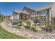 Backyard patio with pergola, hot tub, and landscaping at 4993 Sedona Cir, Parker, CO 80134