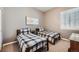 Charming bedroom with twin beds and ample closet space at 4993 Sedona Cir, Parker, CO 80134