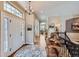 Bright and spacious entryway with hardwood floors and elegant chandelier at 4993 Sedona Cir, Parker, CO 80134