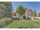 Landscaped front yard with manicured lawn and stone accents at 4993 Sedona Cir, Parker, CO 80134