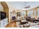 Bright living room with hardwood floors and a fireplace at 4993 Sedona Cir, Parker, CO 80134