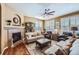 Cozy living room featuring fireplace and hardwood floors at 4993 Sedona Cir, Parker, CO 80134