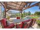 Enjoy dining alfresco in this covered patio area at 4993 Sedona Cir, Parker, CO 80134