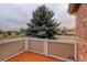 Private deck overlooks a tree and neighborhood at 8865 Federal Blvd # 201, Westminster, CO 80260