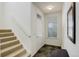 Bright entryway with tile flooring and stairs at 8865 Federal Blvd # 201, Westminster, CO 80260