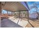 Covered back patio with concrete floor and view of the backyard and storage shed at 3272 W Stanford W Ave, Englewood, CO 80110