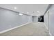 Finished basement with plush carpeting and a stone fireplace at 3272 W Stanford W Ave, Englewood, CO 80110