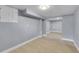Unfinished basement with neutral paint and carpet at 3272 W Stanford W Ave, Englewood, CO 80110