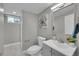 Cozy bathroom featuring modern fixtures and a decorative mirror at 3272 W Stanford W Ave, Englewood, CO 80110