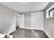 This bedroom features modern gray walls, wood floors, and a spacious closet at 3272 W Stanford W Ave, Englewood, CO 80110