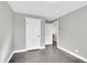 Bedroom with light gray walls, dark floors, and white trim at 3272 W Stanford W Ave, Englewood, CO 80110