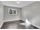 Bedroom with a neutral color palette, dark floors, and natural light at 3272 W Stanford W Ave, Englewood, CO 80110