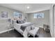 Cozy bedroom with a large bed, soft lighting, and neutral decor at 3272 W Stanford W Ave, Englewood, CO 80110