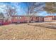 Well-maintained brick home featuring a manicured lawn, and a convenient attached garage at 3272 W Stanford W Ave, Englewood, CO 80110