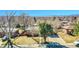 Charming brick home with a well-manicured front yard and mature trees at 3272 W Stanford W Ave, Englewood, CO 80110