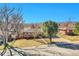 Charming brick home with a well-manicured front yard and mature trees at 3272 W Stanford W Ave, Englewood, CO 80110