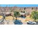 Charming brick home with a well-manicured front yard and mature trees at 3272 W Stanford W Ave, Englewood, CO 80110