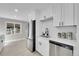 Kitchen featuring white cabinets, stainless steel appliances, quartz countertop and white subway tile backsplash at 3272 W Stanford W Ave, Englewood, CO 80110