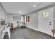 Bright living room with wood floors, seating, decor, and large windows create a welcoming atmosphere at 3272 W Stanford W Ave, Englewood, CO 80110