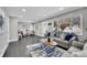 Bright and airy living room featuring modern decor, large windows, and stylish furniture at 3272 W Stanford W Ave, Englewood, CO 80110