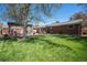 Large, green backyard featuring a patio, a gazebo, privacy fencing and mature trees at 7071 Beach St, Westminster, CO 80030