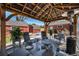 Outdoor patio with comfortable seating and a stylish pergola, perfect for entertaining at 7071 Beach St, Westminster, CO 80030