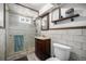 Charming bathroom with a glass shower, updated vanity, and rustic decor provides a stylish space at 7071 Beach St, Westminster, CO 80030
