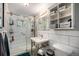 Modern bathroom with updated fixtures, tiled shower, and floating vanity offers a spa-like experience at 7071 Beach St, Westminster, CO 80030