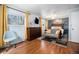 Bright bedroom with hardwood floors, natural light, and a decorative sitting area provides a comfortable space at 7071 Beach St, Westminster, CO 80030