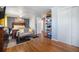 Well-lit bedroom featuring hardwood floors, closet storage, and easy access to an adjoining room at 7071 Beach St, Westminster, CO 80030