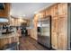 Modern kitchen with stainless steel appliances and warm wood cabinetry at 7071 Beach St, Westminster, CO 80030
