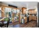 Bright kitchen with wood cabinets and granite countertops with access to backyard patio at 7071 Beach St, Westminster, CO 80030