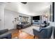 Cozy living room with hardwood floors and stylish gray furniture, perfect for relaxing at 7071 Beach St, Westminster, CO 80030