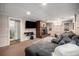 Cozy living room featuring a fireplace, ample seating, and a convenient door to an adjacent room at 7071 Beach St, Westminster, CO 80030