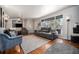 Bright living room with hardwood floors, a large window, and comfortable seating at 7071 Beach St, Westminster, CO 80030