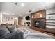 Cozy living room featuring a fireplace, ample seating, and convenient access to adjacent rooms at 7071 Beach St, Westminster, CO 80030