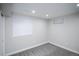 Finished basement area with neutral walls, carpet, and windows at 17657 E Prentice Cir, Aurora, CO 80015