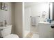 Updated bathroom featuring white vanity, sink, and shower with modern fixtures at 17657 E Prentice Cir, Aurora, CO 80015