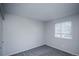 Cozy bedroom features plush carpeting, a window, and neutral walls at 17657 E Prentice Cir, Aurora, CO 80015