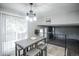 Light-filled dining area boasts modern pendant lighting and access to a deck through sliding glass doors at 17657 E Prentice Cir, Aurora, CO 80015