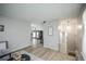 Open floor plan with stairs, light-colored walls and laminate flooring at 17657 E Prentice Cir, Aurora, CO 80015