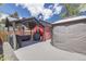 Backyard featuring a patio, grill, gazebo, and red shed for outdoor enjoyment at 935 Newark St, Aurora, CO 80010