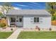 Well-kept single-story house boasting a neat lawn and welcoming front entrance at 935 Newark St, Aurora, CO 80010
