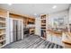 Updated kitchen features stainless appliances, modern countertops, open shelving and wood flooring at 935 Newark St, Aurora, CO 80010