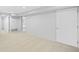 Finished basement with neutral carpet and ample space for storage or recreation at 1180 S Honey Way, Denver, CO 80224